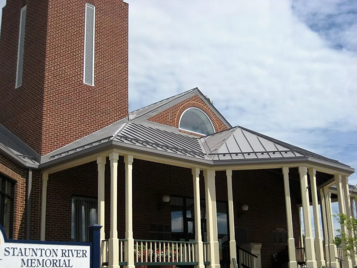Skilled roofing craftsmen working on a residential roof in Winston